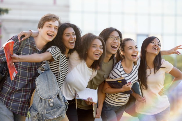 multiethnic-group-young-happy-students-standing-outdoors_171337-11812.jpg